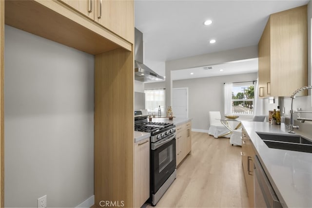 6820 Jellico Ave, Van Nuys, CA 91406 - kitchen with stainless steel appliances, wall chimney exhaust hood, recessed lighting, light wood finished floors, and light countertops