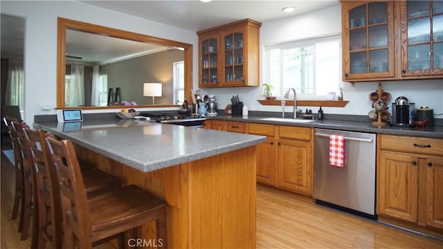 412 N Mallagh St, Nipomo, CA 93444 - kitchen with dishwasher, a kitchen bar, brown cabinetry, glass insert cabinets, and recessed lighting