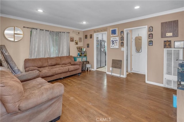 9430 Mines Ave, Pico Rivera, CA 90660 - living room featuring light wood-type flooring, crown molding, and recessed lighting