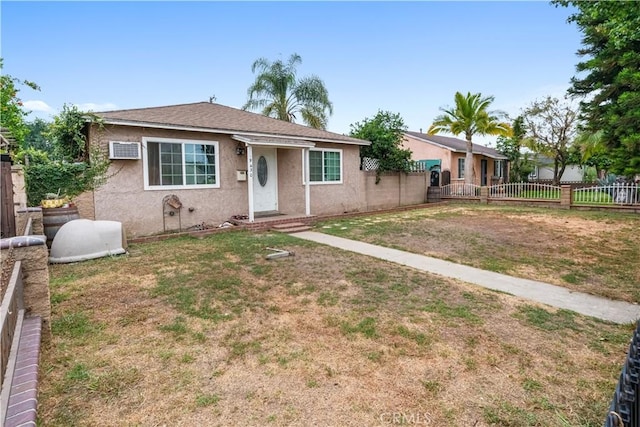 9430 Mines Ave, Pico Rivera, CA 90660 - view of front facade featuring stucco siding and a wall mounted AC