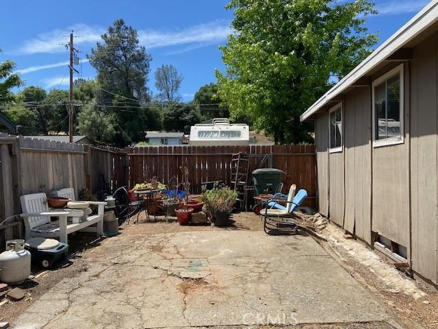 7 Westwood Way, Oroville, CA 95966 - fenced backyard with a patio area