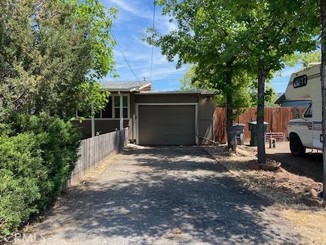 7 Westwood Way, Oroville, CA 95966 - view of front of home featuring a garage and asphalt driveway