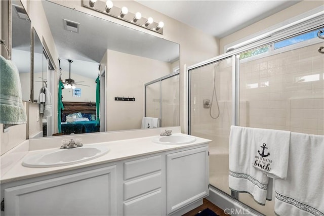 3038 Kaylyn St, Lancaster, CA 93535 - ensuite bathroom with double vanity, a stall shower, and ceiling fan