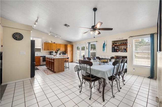 3038 Kaylyn St, Lancaster, CA 93535 - dining space with lofted ceiling, rail lighting, a ceiling fan, healthy amount of natural light, and light tile patterned floors