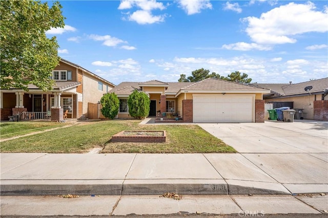 3038 Kaylyn St, Lancaster, CA 93535 - view of front of property with an attached garage, driveway, a tile roof, brick siding, and stucco siding