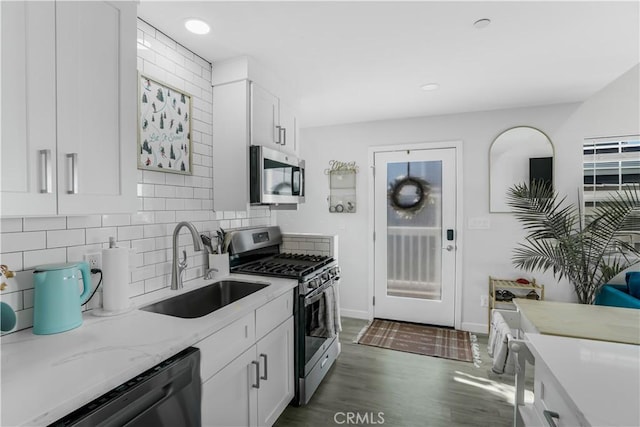 5924 Gran Paseo Way, Atascadero, CA 93422 - kitchen featuring stainless steel appliances, dark wood-style flooring, white cabinetry, decorative backsplash, and recessed lighting