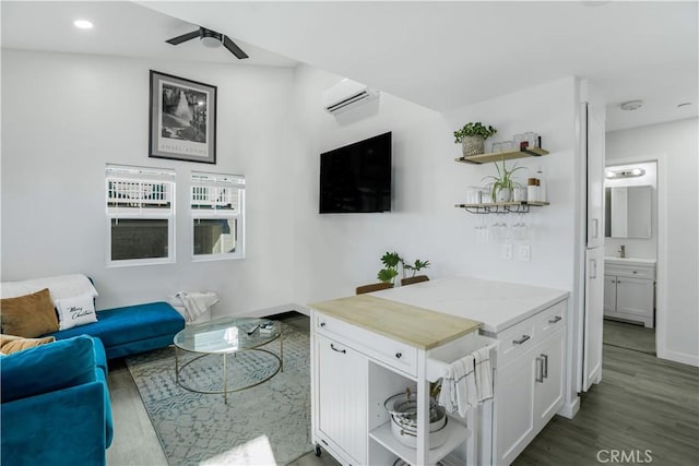 5924 Gran Paseo Way, Atascadero, CA 93422 - living room with wood finished floors, ceiling fan, recessed lighting, and a wall mounted air conditioner