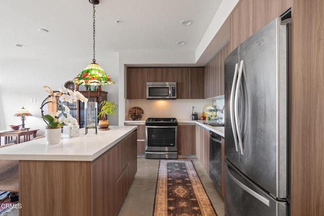 482 S Arroyo Pkwy Unit 405, Pasadena, CA 91105 - kitchen featuring stainless steel appliances, modern cabinets, concrete flooring, and light countertops