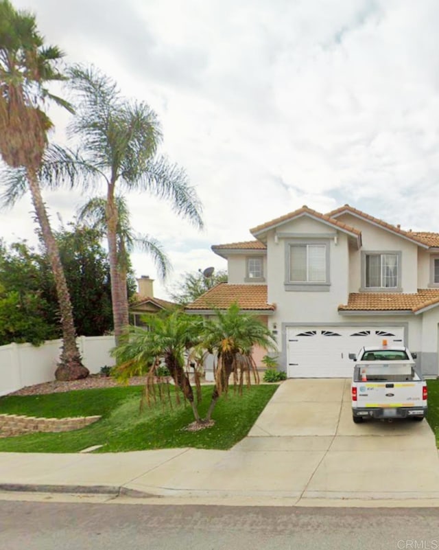 926 Via Cedro, Chula Vista, CA 91910 - mediterranean / spanish home featuring a garage, driveway, stucco siding, and a tile roof