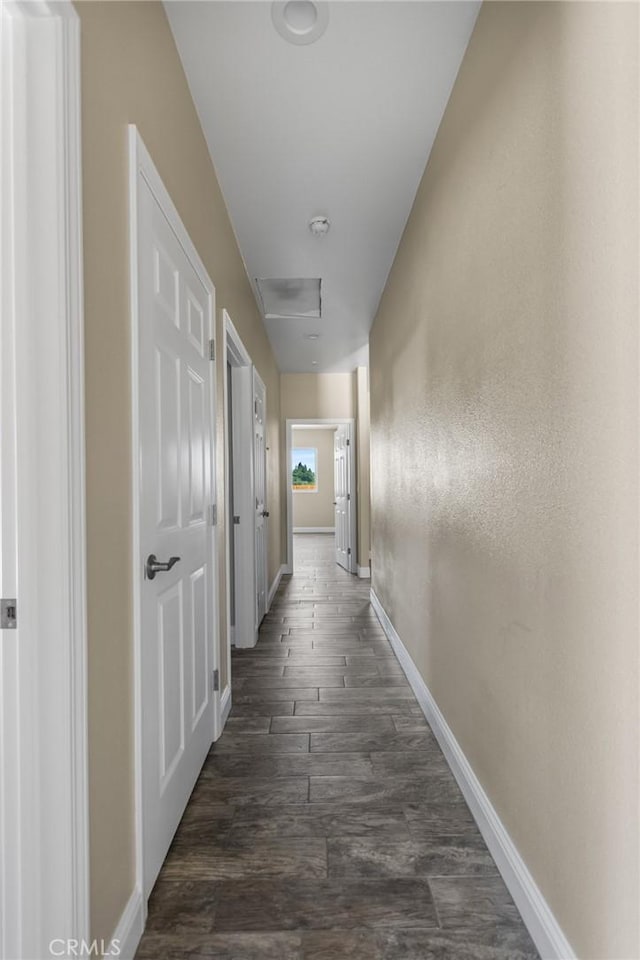 1021 Prince William Ct, Atwater, CA 95301 - corridor with dark wood-style floors and attic access