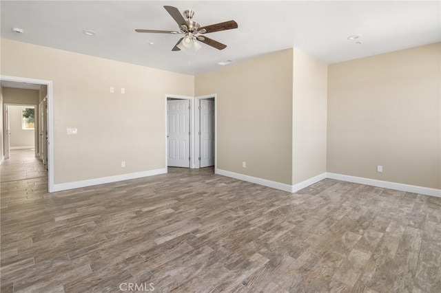 1021 Prince William Ct, Atwater, CA 95301 - spare room with wood finished floors, a ceiling fan, and recessed lighting