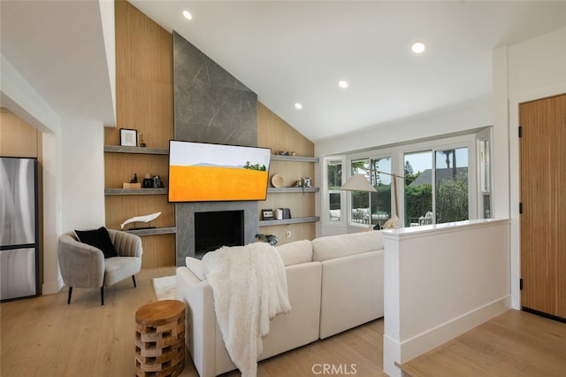 25302 Posada Ln, Mission Viejo, CA 92691 - living room with light wood-style floors, recessed lighting, built in shelves, a fireplace, and high vaulted ceiling