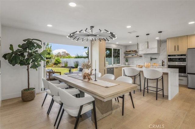 25302 Posada Ln, Mission Viejo, CA 92691 - dining area featuring recessed lighting, light wood finished floors, and a water view