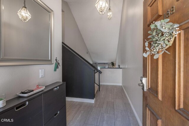 15050 Sherman Way Unit 189, Van Nuys, CA 91405 - entrance foyer with stairs, wood finished floors, and vaulted ceiling