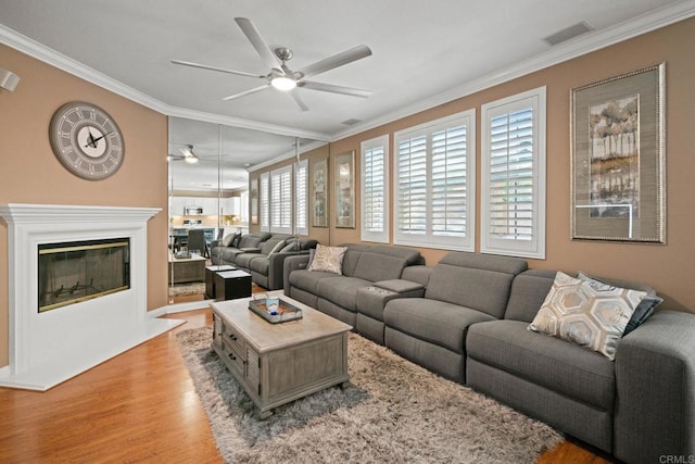 5191 Cobalt Way, Oceanside, CA 92057 - living area with a ceiling fan, ornamental molding, and light wood-style flooring