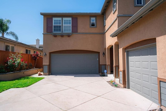 5191 Cobalt Way, Oceanside, CA 92057 - mediterranean / spanish house with stucco siding, an attached garage, and driveway