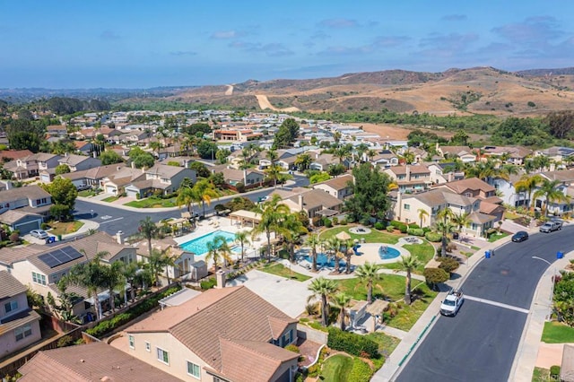 5191 Cobalt Way, Oceanside, CA 92057 - aerial perspective of suburban area with a pool and a mountain backdrop