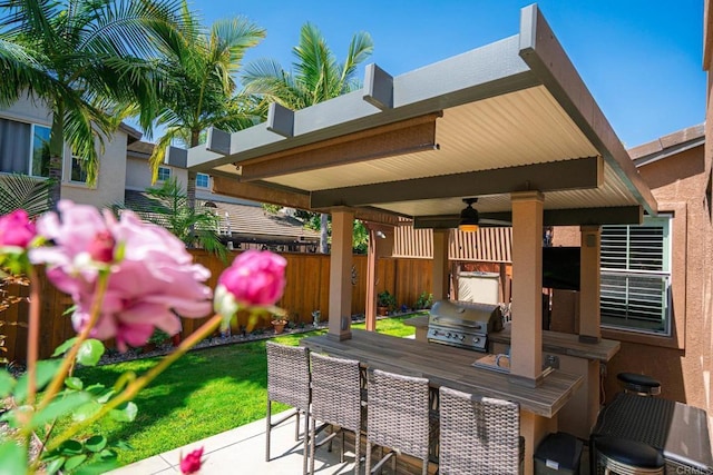 5191 Cobalt Way, Oceanside, CA 92057 - view of patio with an outdoor kitchen, a ceiling fan, and an outdoor bar