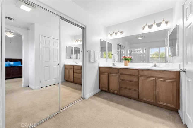 15216 Masline St, Baldwin Park, CA 91706 - full bathroom with double vanity, ceiling fan, and carpet floors