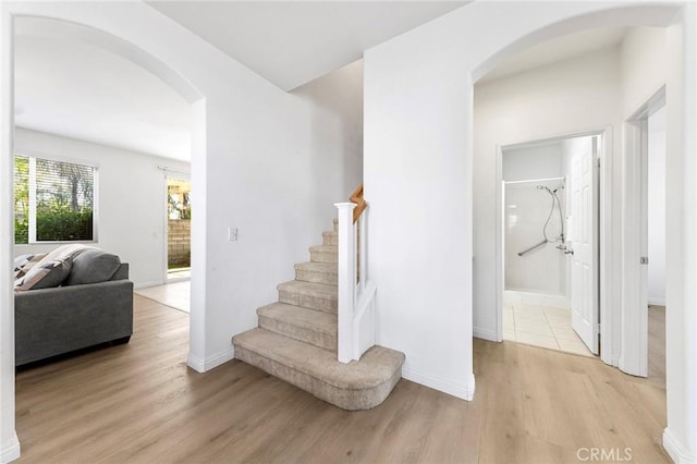 15216 Masline St, Baldwin Park, CA 91706 - stairway with arched walkways and wood finished floors