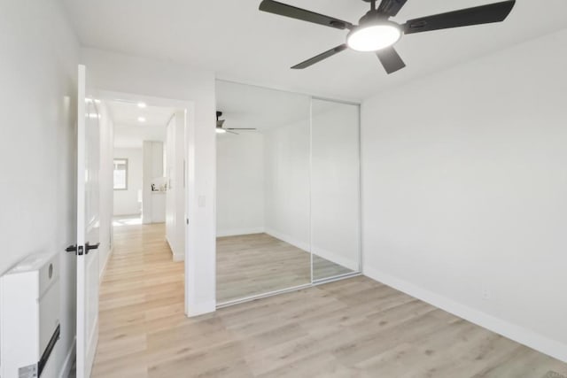 3535 Monroe Ave Unit 5, San Diego, CA 92116 - unfurnished bedroom featuring light wood finished floors, a closet, and ceiling fan