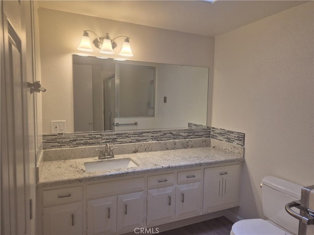 1501 Pelham Rd Unit 127J, Seal Beach, CA 90740 - bathroom with vanity and tasteful backsplash