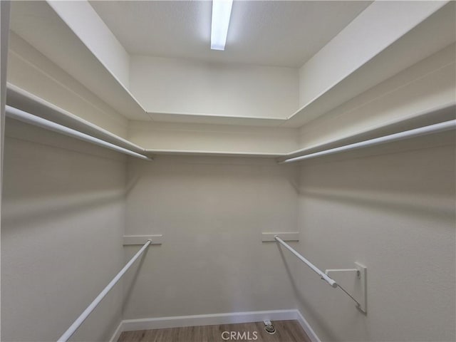 1501 Pelham Rd Unit 127J, Seal Beach, CA 90740 - walk in closet featuring wood finished floors