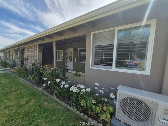 1501 Pelham Rd Unit 127J, Seal Beach, CA 90740 - view of home's exterior with a cooling unit and stucco siding