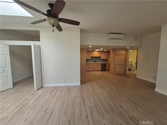 1501 Pelham Rd Unit 127J, Seal Beach, CA 90740 - unfurnished living room featuring a wall mounted AC, light wood finished floors, ceiling fan, and recessed lighting