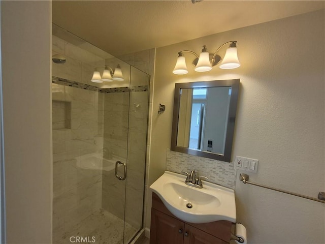 1501 Pelham Rd Unit 127J, Seal Beach, CA 90740 - bathroom with a stall shower, vanity, and tasteful backsplash