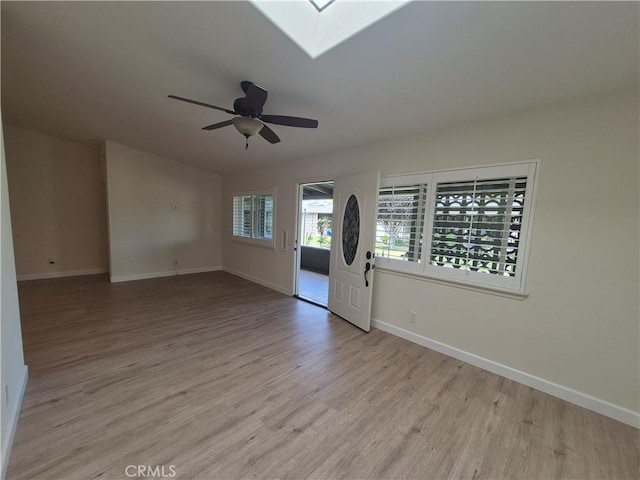 1501 Pelham Rd Unit 127J, Seal Beach, CA 90740 - spare room featuring light wood finished floors, a skylight, and a ceiling fan