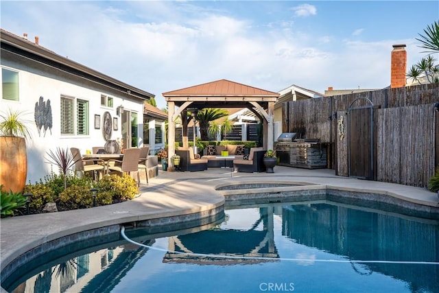 25891 Pinewood Ln, Laguna Hills, CA 92653 - view of pool with a gazebo, an outdoor kitchen, a patio area, outdoor lounge area, and a pool with connected hot tub