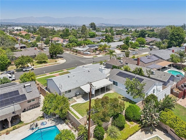 17148 Stare St, Northridge, CA 91325 - aerial perspective of suburban area with a pool area and a mountain backdrop