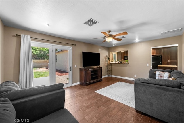 44112 Precise St, Lancaster, CA 93536 - living area featuring a ceiling fan and dark wood-style flooring