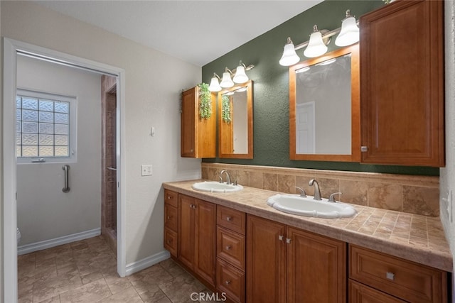 44112 Precise St, Lancaster, CA 93536 - bathroom with double vanity, a shower stall, and decorative backsplash