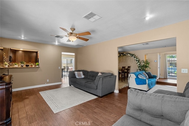 44112 Precise St, Lancaster, CA 93536 - living room featuring dark wood-style floors and a ceiling fan