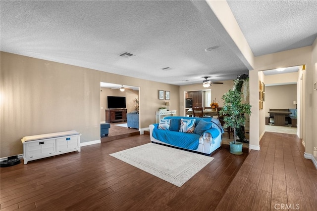 44112 Precise St, Lancaster, CA 93536 - living area featuring ceiling fan, a textured ceiling, and wood finished floors