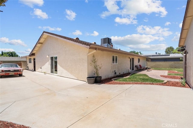 44112 Precise St, Lancaster, CA 93536 - view of property exterior with stucco siding, a patio area, and driveway