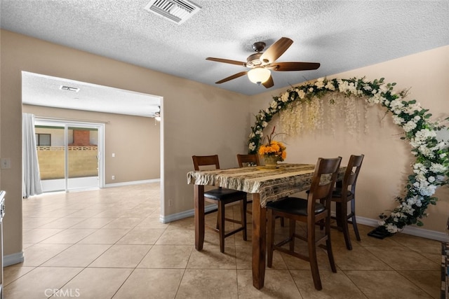 44112 Precise St, Lancaster, CA 93536 - dining room featuring a textured ceiling, ceiling fan, and light tile patterned flooring