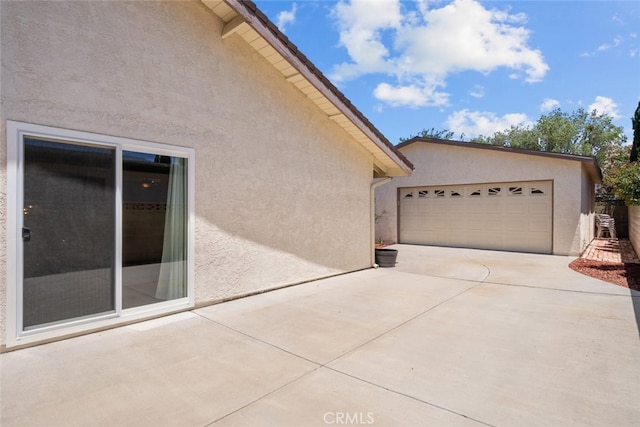44112 Precise St, Lancaster, CA 93536 - view of home's exterior featuring stucco siding and a garage