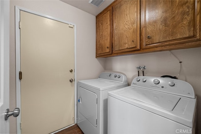 44112 Precise St, Lancaster, CA 93536 - laundry room featuring washing machine and dryer, cabinet space, and dark wood-type flooring