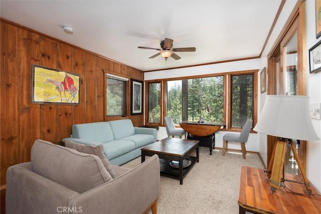 2576 Chilnualna Ln, Wawona, CA 95389 - living room with ceiling fan, wood walls, light carpet, and ornamental molding