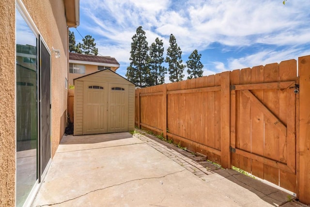 4540 Maple Ave Unit 153, La Mesa, CA 91941 - fenced backyard with a patio area and a storage unit