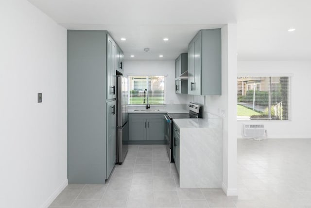4540 Maple Ave Unit 153, La Mesa, CA 91941 - kitchen with stainless steel appliances, light countertops, light tile patterned floors, recessed lighting, and gray cabinetry