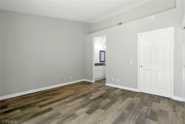 24571 Camden Ct, Laguna Niguel, CA 92677 - unfurnished bedroom featuring dark wood-style floors and connected bathroom
