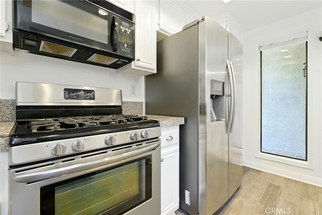 24571 Camden Ct, Laguna Niguel, CA 92677 - kitchen with appliances with stainless steel finishes, white cabinets, light wood finished floors, and light stone countertops