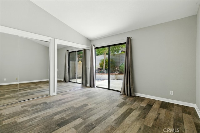 24571 Camden Ct, Laguna Niguel, CA 92677 - empty room with lofted ceiling and wood finished floors