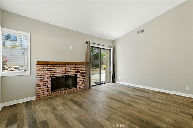 24571 Camden Ct, Laguna Niguel, CA 92677 - unfurnished living room featuring wood finished floors, a brick fireplace, and lofted ceiling