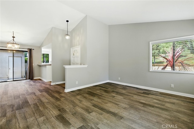 24571 Camden Ct, Laguna Niguel, CA 92677 - unfurnished room with vaulted ceiling, wood finished floors, and a chandelier