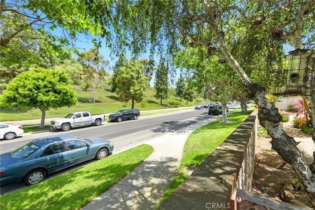 24571 Camden Ct, Laguna Niguel, CA 92677 - view of asphalt road with sidewalks